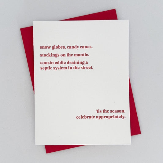 A Letterpress Holiday Card with text that reads 'snow globes. candy canes. stockings on the mantle. cousin eddie draining a septic system in the street 'tis the season. celebrate appropriately.' in red lettering.