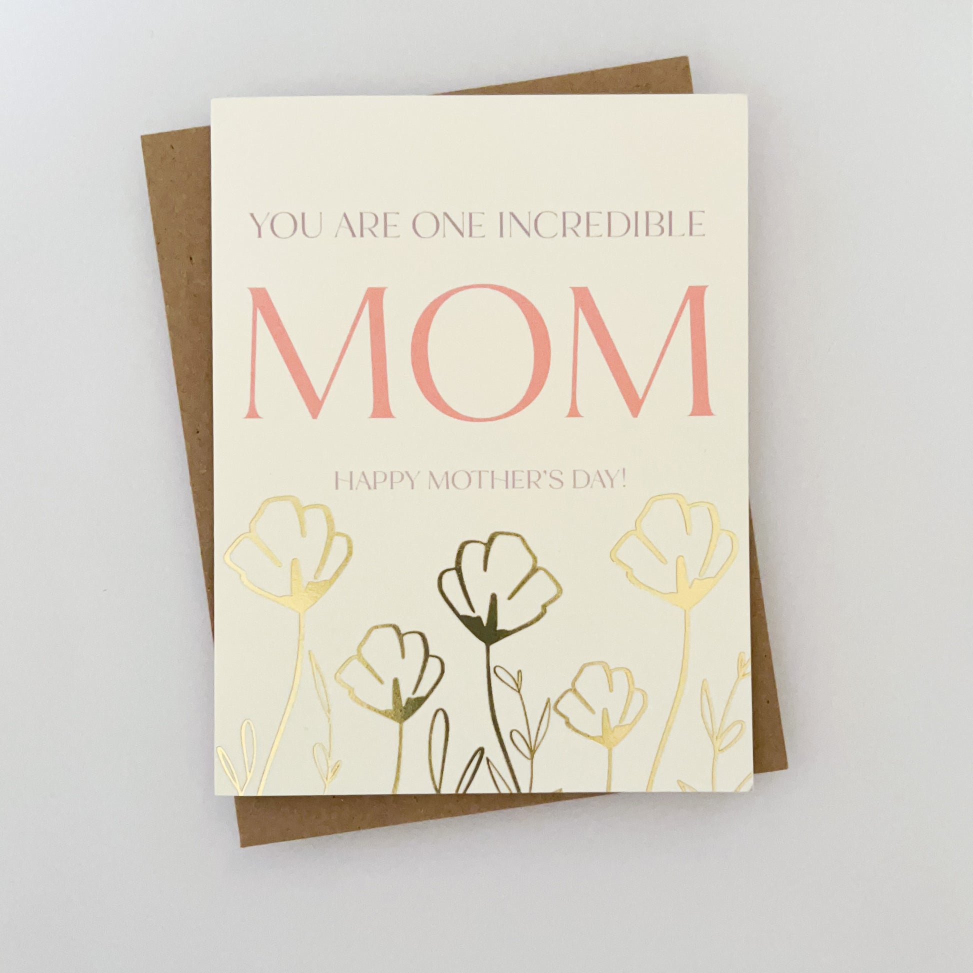 A mothers day card with gold foil florals and text that reads 'you are one incredible MOM happy mothers day!'