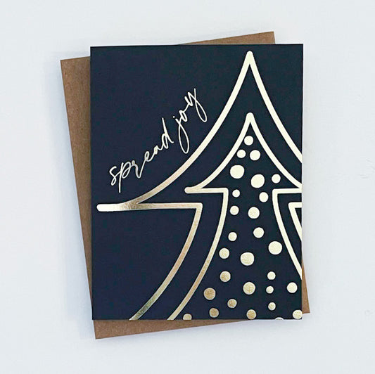 A holiday greeting card with a polka dot pattern and a golden tree design on a navy background, with the text 'Spread joy' on the front.