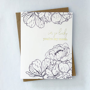 A mothers day card with black florals framing gold foil text that reads 'I'm so lucky you're my mom'