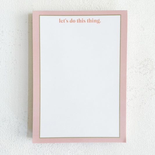 A notepad with a pink and green border, white background, and the text 'let's do this thing.' in pink at the top.