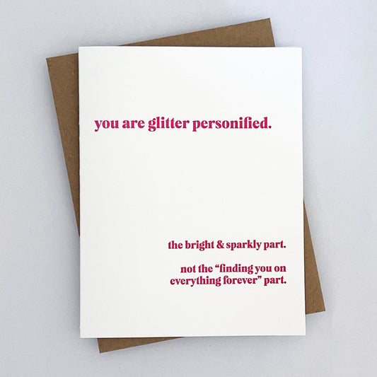 A Letterpress Everyday Card with pink text that reads 'you are glitter personified' 'the bright & sparkly part. not the "finding you on everything forever" part.'