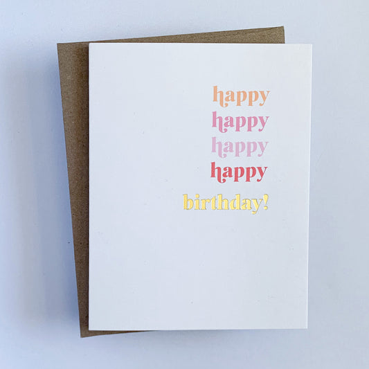 A multi-colored letterpress birthday card with 'Happy Happy Happy Happy Birthday' text in different colors gold foil displayed with a Kraft envelope.