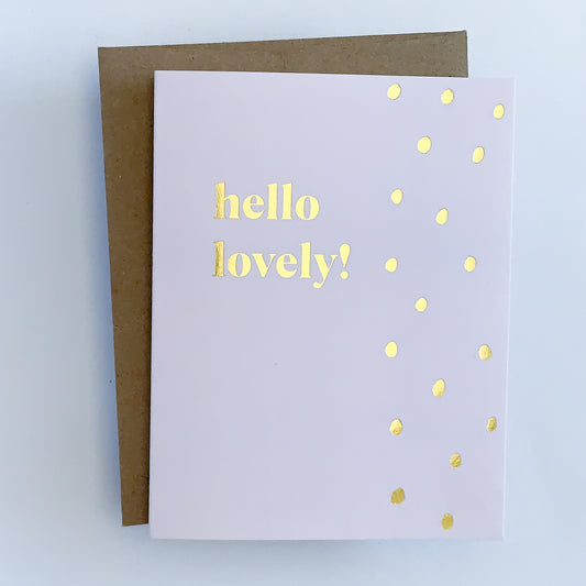 A light purple greeting card with gold foil dot accents and text that reads ' Hello Lovely!'